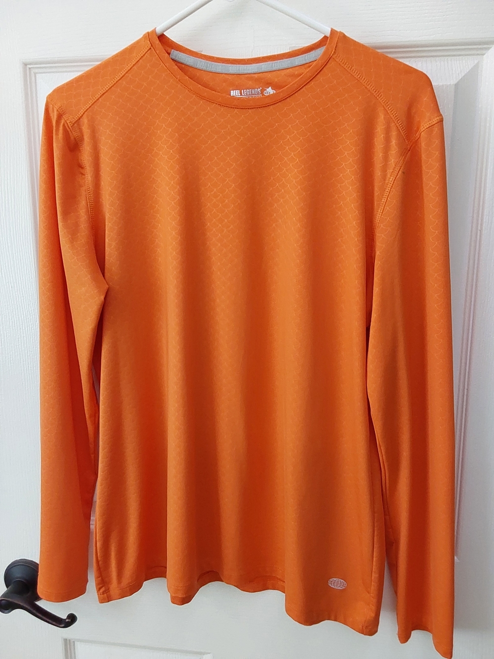 Reel Legends Women's Long-Sleeve Performance Tee in Bright Orange